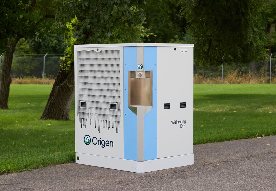 Origen Wellspring 100 atmospheric water generator installed outdoors on a pad — off-grid water from air with no plumbing connection